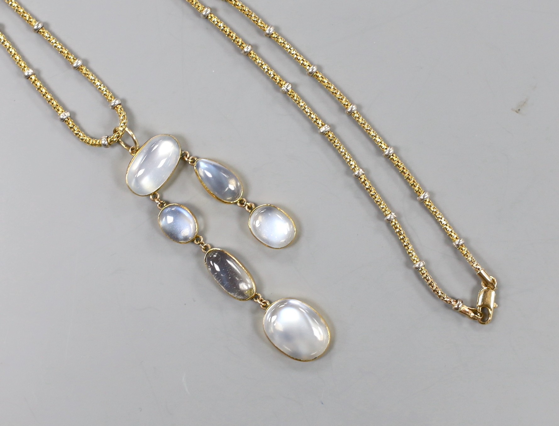 A 375 and six stone cabochon moonstone set drop necklace, with white metal spacers, approx. 60cm, gross weight 10.4 grams.